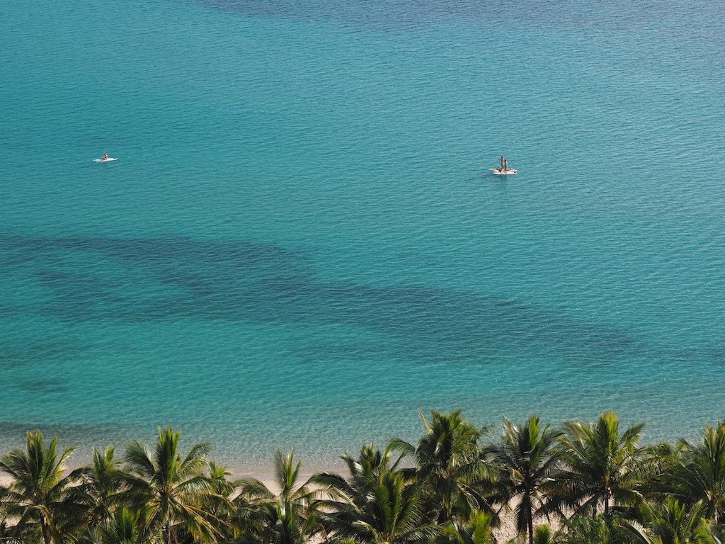 Stand up paddleboarders just off Catseye Beach