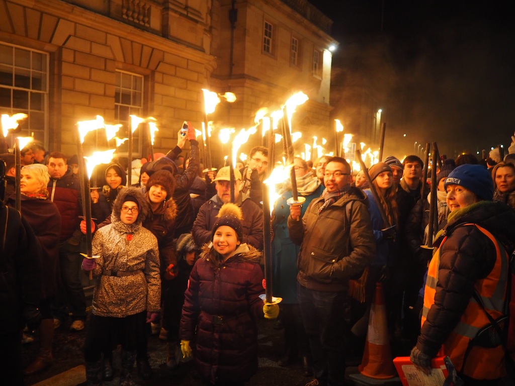 Eager touch bearers queue to be near the front of the procession