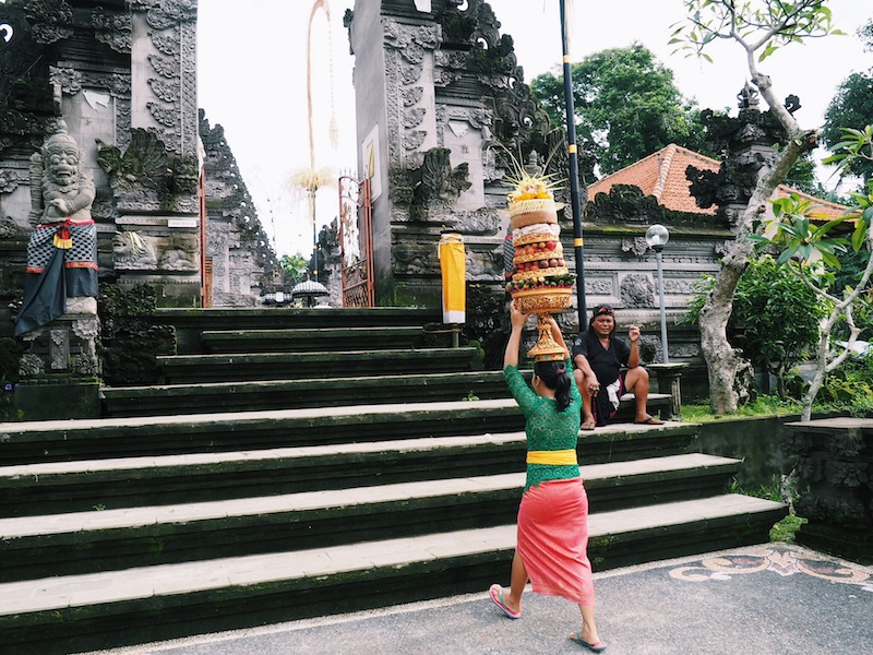 Women bring offerings to the temple ahead of the Nyepi Day celebrations