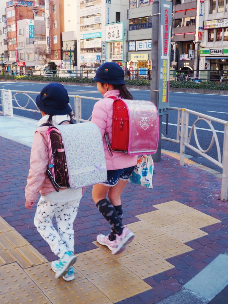 Young girls walking themselves to school in Tokyo