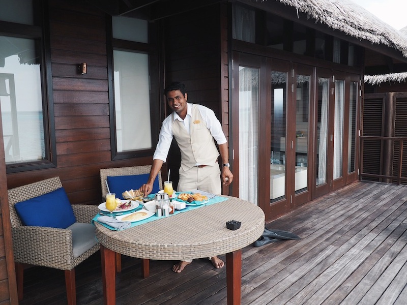 Smiling butler Mohan sets up our in-villa breakfast