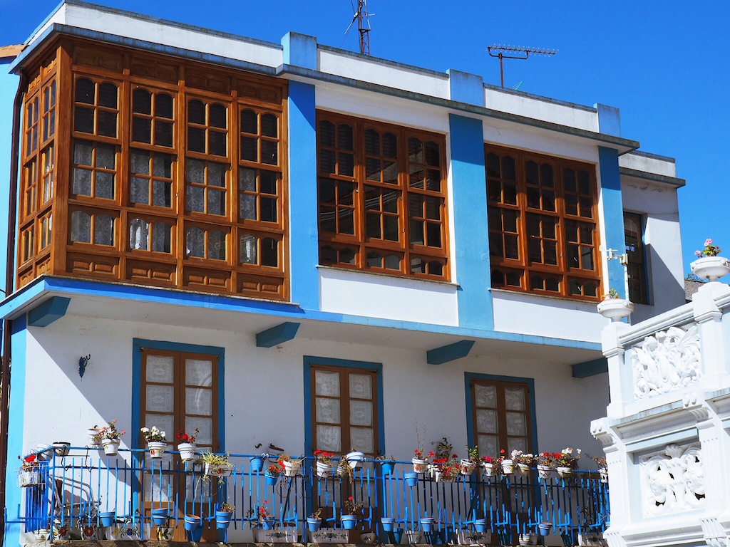 Houses co-ordinate with the ocean in the village of Redes