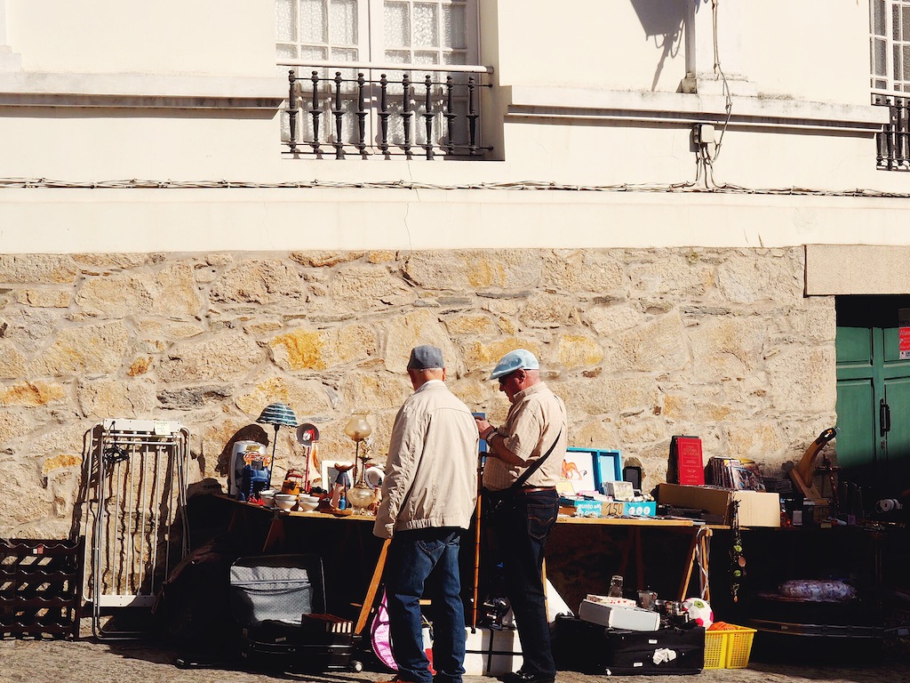 Old men browsing the weekend market in Pontedeume