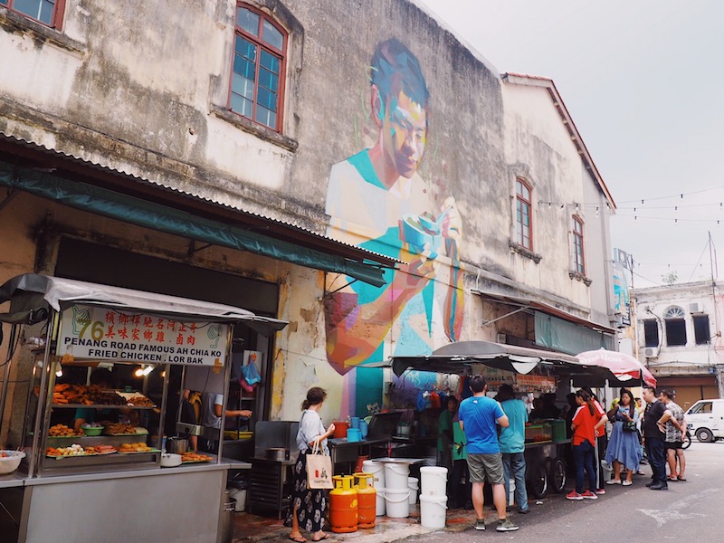 Mural of boy eating Penang Road famous cendol by by Canadian street artist Emmanuel Jarus