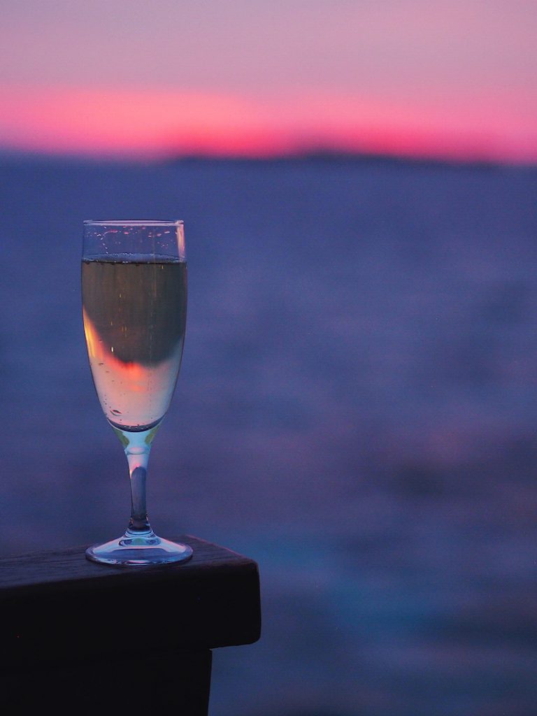 Champagne at sunset in the Maldives