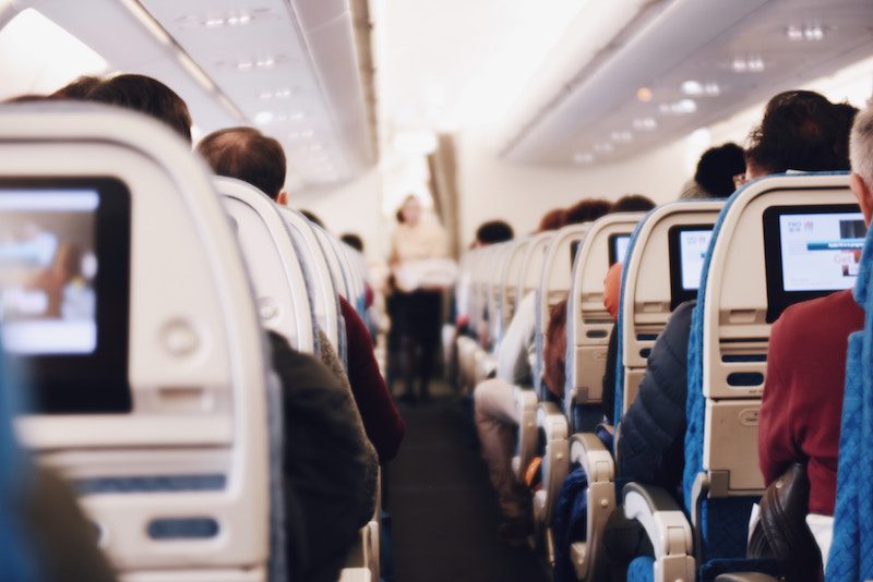 How best to sleep on a plane In economy class | Girl Tweets World | Photo by Suhyeon Choi on Unsplash